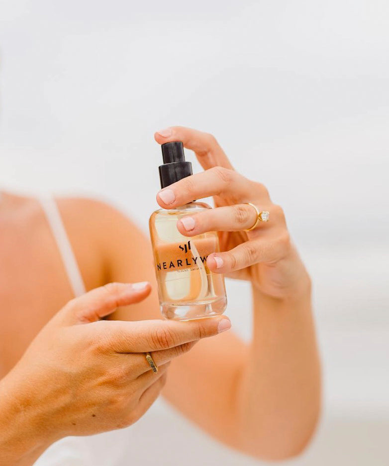 Hands_Side_Hold_50ml_on_beach_Brooke_1.jpg